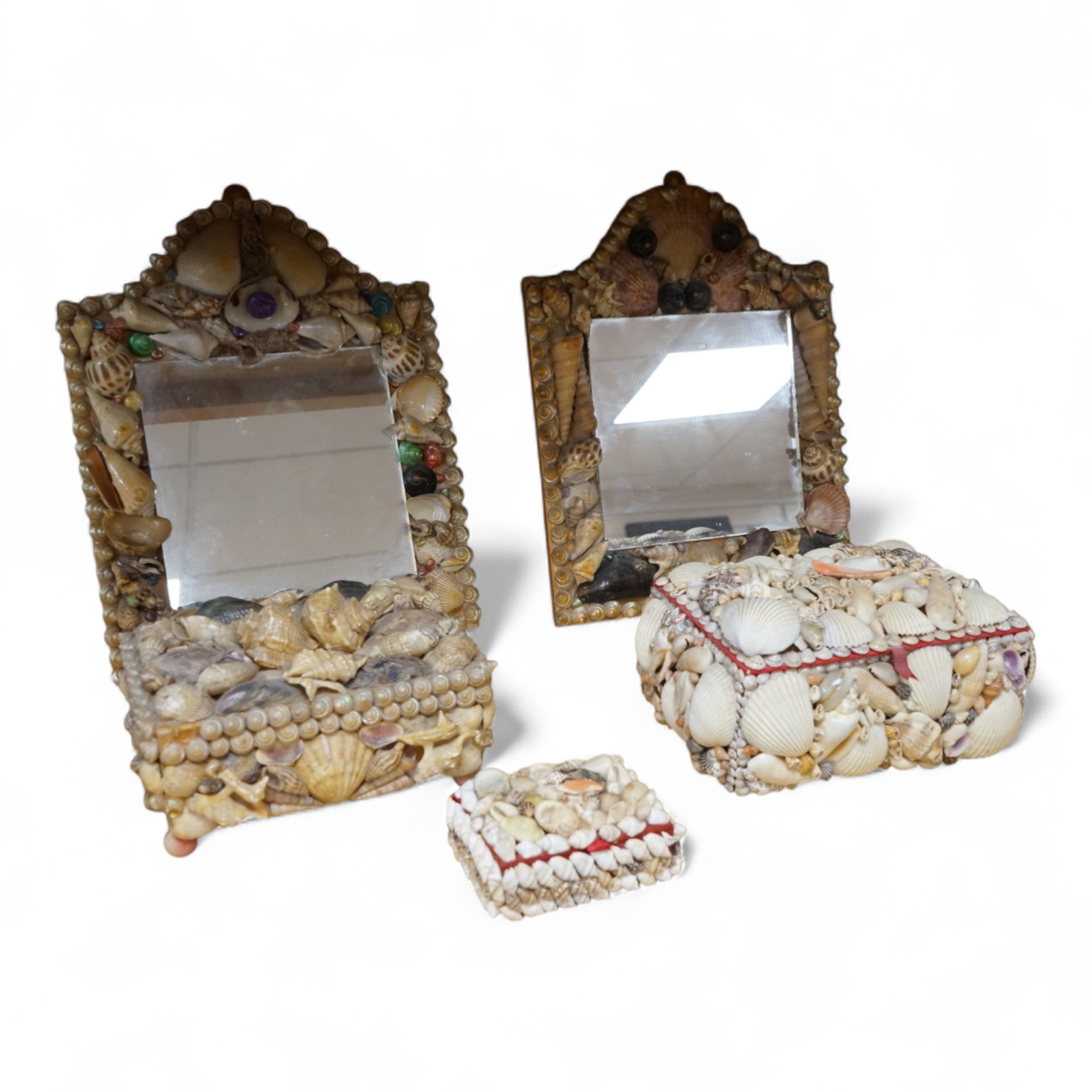 A near pair of French shell applied wall mirrors and three similar boxes, largest 29cm high